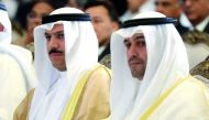 Kuwaiti Finance Minister Anas al-Saleh (R) and Mohammad al-Hashel, Kuwait's Central Bank Governor, attend the Euromoney conference held in the capital Kuwait City on September 26, 2017. AFP / Yasser Al-Zayyat