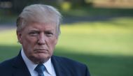 (FILES) This file photo taken on September 24, 2017 shows US President Donald Trump speaking to the press at the White House in Washington, DC, upon arrival from his New Jersey golf club.  / AFP / NICHOLAS KAMM
