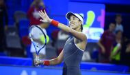 Garbine Muguruza of Spain celebrates after winning against Magda Linette of Poland during their third round women’s singles match at the WTA Wuhan Open in Wuhan, in China’s central Hubei province, yesterday.