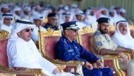Prime Minister and Interior Minister H E Sheikh Abdullah bin Nasser bin Khalifa Al Thani and Staff Major General Saad bin Jassim Al Khulaifi, the Director-General of Public Security, and other officials at the graduation ceremony of the diving and parachu