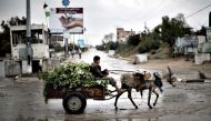 FILE PHOTO: A Palestinian boy rides a donkey cart in Beit Hanun, northern Gaza Strip.  (AFP / Mahmud Hams) 