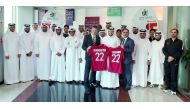 Neil Doncaster, Chief Executive of the Scottish Professional Football League and Director of Operations at the Qatar National Teams, Ahmed Khellil Abbassi along with QFA delegates pose for a group photo following the conclusion of workshop at Aspire Acade