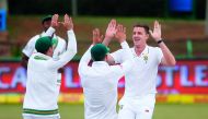South African bowler Morne Morkel (left) celebrates the dismissal of Bangladeshi batsman Mominul Haque (not in picture) during the fourth day of the first Test match against Bangladesh, yesterday.