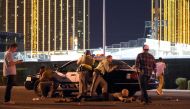 Las Vegas police stand guard along the streets outside the the Route 91 Harvest country music festival grounds after a active shooter was reported on October 1, 2017 in Las Vegas, Nevada. There are reports of an active shooter around the Mandalay Bay Reso
