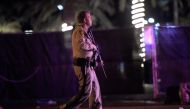 LAS VEGAS, NV - OCTOBER 02: Las Vegas police patrol along the streets outside the the Route 91 Harvest country music festival grounds after a active shooter was reported on October 1, 2017 in Las Vegas, Nevada. A gunman has opened fire on a music festival