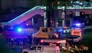 Police and rescue personnel gather at the intersection of Las Vegas Boulevard and Tropicana Ave. after a mass shooting at a country music festival nearby on October 2, 2017 in Las Vegas, Nevada. Ethan Miller/AFP
