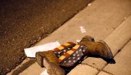 A pair of cowboy boots is shown in the street outside the concert venue after a mass shooting at a music festival on the Las Vegas Strip in Las Vegas, Nevada, U.S. October 1, 2017. Reuters/Las Vegas Sun/Steve Marcus