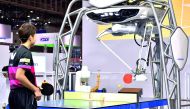 FORPHEUS, a fourth-generation table-tennis robot developed by automation parts maker Omron, returns a shot to a human player during a press preview at the Combined Exhibition of Advanced Technologies (CEATEC) Japan in Chiba, suburban Tokyo on October 2, 2