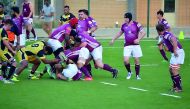 Doha RFC players fight for ball possession with Kuwait Scorpions RFC in their Gulf Conference League game in Kuwait.