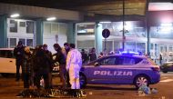(FILES) This file photo taken on December 23, 2016 shows Italian police and forensics experts gathering around the body of suspected Berlin truck attacker Anis Amri after he was shot dead in Milan on December 23, 2016.   AFP / DANIELE BENNATI
