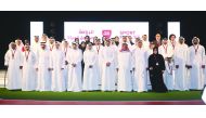 Winners of the annual Sport Excellence Awards pose for a photograph with Qatar Olympic Committee (QOC) President H E Sheikh Joaan bin Hamad Al Thani and officials of QOC and sport associations at the Qatar National Convention Centre yesterday. Pictures: M