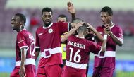 Al Markhiya players celebrate their 2-0 win over Al Sadd on day two of the QSL Cup on Wednesday. 