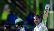 South Africa’s Dean Elgar raises his bat as he celebrates his century during the first day of the second Test match against Bangladesh in Bloemfontein yesterday.