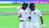 Sadeera Samarawickrama (left) and Dimuth Karunaratne of Sri Lanka leave the field during the first day of the second Test match against Pakistan at Dubai International Stadium in Dubai, yesterday.
