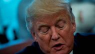 US President Donald Trump speaks about business during a proclamation signing in the Oval Office of the White House October 6, 2017 in Washington, DC. / AFP / Brendan Smialowski
