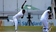 South Africa's bowler Kagiso Rabada (L) delivers a ball to Bangladesh Mahmudullah to take his 100th Test match wicket during the third day of the second Test cricket match between South Africa and Bangladesh in Bloemfontein on October 8, 2017. (AFP / MARC