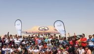 Riders and officials pose for a group photo after the conclusion of first Al Kheesa XCO Race of the Qatar Mountain Bike League (QMBL) season.
