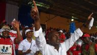 Liberian presidential candidate Alexander Cummings waves to supporters during a campaign rally in Monrovia, two days ahead of the country’s elections. PHOTO | ISSOUF SANOGO | AFP.