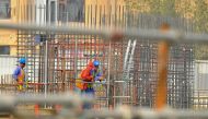 (File photo) Construction workers at a Doha Project. Baher Amin © The Peninsula