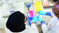 Researchers at Qatar Shell Research and Technology Centre during an experiment. 