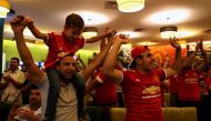 A group of Iraqi Manchester United football supporters gather at a cafe to watch a match in Baghadad on September 18, 2017. AFP / SABAH ARAR
