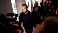 Joshua Boyle walks through the airport after arriving with his wife and three children at Toronto Pearson International Airport, nearly 5 years after he and his wife were abducted in Afghanistan in 2012 by the Taliban-allied Haqqani network, in Toronto, O