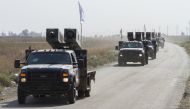Iraqi security forces' armoured vehicles are deployed to meters away from the Peshmerga site in Kirkuk, Iraq on October 14, 2017.  Hassan Ghaedi - AA