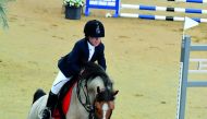 A young rider competes during the opening round of Hathab at Al Shaqab’s Indoor Arena on Saturday. 