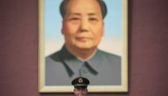 A Chinese paramilitary guard stands in front of a portrait of late communist leader Mao Zedong at Tiananmen Square in Beijing on October 16, 2017. The Chinese Communist Party's week-long, twice-a-decade congress will open on October 18.  AFP / Fred Dufour