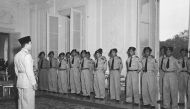 This file photo taken on March 24, 1950 shows President Sukarno receiving officers of the battalion Worang at the palace Gambir in parting. The United States government had intimate knowledge of the Indonesian army's bloody anti-communist purge in the 196
