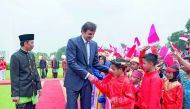 Emir H H Sheikh Tamim bin Hamad Al Thani shaking hands with children as the President of the Republic of Indonesia, Joko Widodo looks on, in Jakarta yesterday.