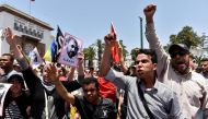 Protesters shout slogans during a demonstration against corruption and official abuses, in the Rif region in Rabat, Morocco June 11, 2017. On left is a portrait of protest movement leader Nasser Zefzafi. REUTERS/Stringer