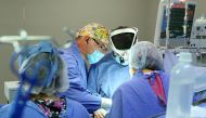 Handout picture released by the Mexican Social Security Institute (IMSS in Spanish) press office showing doctor David Arellano (C) conducting a surgery at the La Raza hospital in Mexico City, on September 14, 2017.
