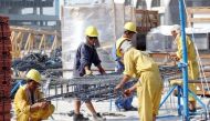 File picture of labourers at a construction site used for representation.