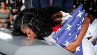 FILE PHOTO: Myeshia Johnson, wife of U.S. Army Sergeant La David Johnson, who was among four special forces soldiers killed in Niger, kisses his coffin at a graveside service in Hollywood, Florida, October 21, 2017. REUTERS/Joe Skipper/File Photo
