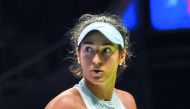 Caroline Garcia of France reacts on a point against Elina Svitolina of Ukraine during the WTA Finals tennis tournament in Singapore on October 25, 2017.  AFP / Roslan Rahman