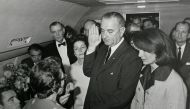 A file photo of US Vice President Lyndon Baines Johnson (C) takes the presidential oath of office from Judge Sarah T. Hughes (2nd from L) as President John F. Kennedy's widow first lady Jacqueline Bouvier Kennedy (2nd from R) stands at his side aboard Air