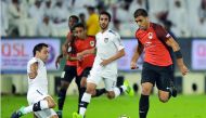 Al Sadd’s Xavi Fernandez (left) and Al Rayyan’s Abderrazaq Hamdallah vie for ball possession during the QNB Stars League (QSL) match at Al Sadd Stadium in Doha yesterday. Al Rayyan won 2-1. 
Pictures: Kammutty VP/The Peninsula