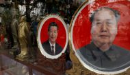 Souvenir plates with images of Chinese late Chairman Mao Zedong (R) and Chinese President Xi Jinping are seen in Beijing, China, October 21, 2017. Reuters/Tyrone Siu