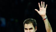 Roger Federer of Switzerland celebrates with the cup after defeating Juan Martin del Potro of Argentina. Reuters/Arnd Wiegmann
