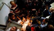 People gather around bodies of Palestinians killed in a tunnel near the border between Israel and central Gaza Strip October 30, 2017. Reuters/Mohammed Salem
