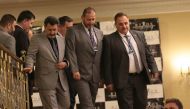 Syrian rebel representative General Ahmad Berri (R) and other attendees walk during a seventh round of Syria peace talks in Astana on October 31, 2017.  AFP / Stanislav Filippov