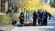 New York city first responders stand at the crime scene on a bike path in lower Manhattan in New York, NY, U.S., October 31, 2017. Reuters/Brendan McDermid