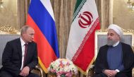 Russian President Vladimir Putin (L) and Iranian President Hassan Rouhani look at each other during a meeting in Tehran on November 1, 2017. (AFP / SPUTNIK / Alexey DRUZHININ)