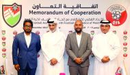 Sheikh Hamad bin Khalifa bin Ahmed Al Thani, President of the QFA, Bassam Adeel Jaleel, President of the FAM, and Saoud Al Mohannadi, Vice-President of the QFA pose for a group picture after the agreement signing ceremony in Doha yesterday.