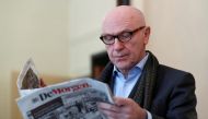Sacked Catalan leader Carles Puigdemont's Belgian lawyer, Paul Bekaert, reads a newspaper in his office in Tielt in Belgium November 2, 2017. Reuters/Yves Herman