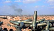 Smoke billows from the eastern Syrian city of Deir Ezzor during an operation by government forces against Islamic State militants. Army and allied forces have taken full control of Deir Ezzor from the IS. 