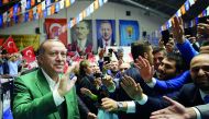 Turkish President Recep Tayyip Erdogan (L) greets people as he attends the provincial meeting of Justice and Development (AK) Party in Manisa, Turkey on November 03, 2017. (Turkish Presidency / Yasin Bulbul / Handout - Anadolu Agency )