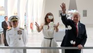 US President Donald Trump and first lady Melania Trump scatter flower petals in the water at the USS Arizona Memorial in Honolulu, Hawaii, U.S. November 3, 2017. REUTERS/Jonathan Ernst