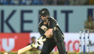 New Zealand batsman Colin Munro plays a shot during the second T20 international cricket match between India and New Zealand at the Saurashtra Cricket Association Stadium in Rajkot on November 4, 2017. GETTYOUT / AFP / PUNIT PARANJPE 